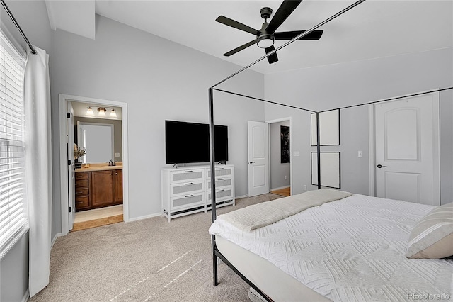 3838 Brush Rd, Castle Rock, CO 80108 - carpeted bedroom featuring high vaulted ceiling, a sink, baseboards, ensuite bathroom, and a ceiling fan