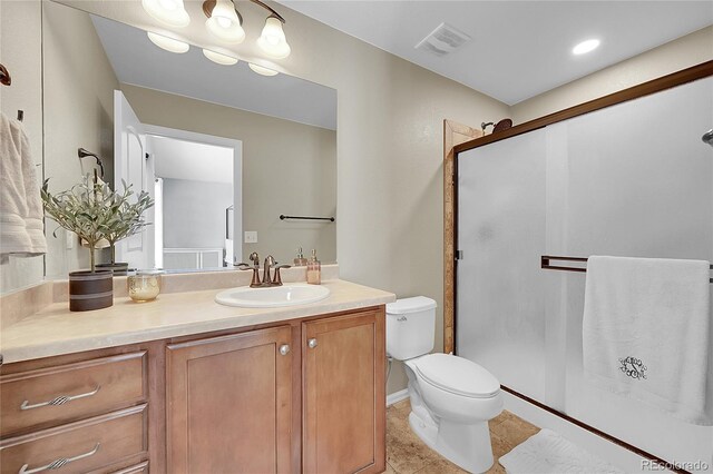 3838 Brush Rd, Castle Rock, CO 80108 - bathroom featuring toilet, a shower stall, vanity, and tile patterned floors