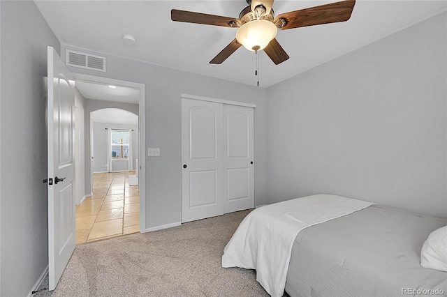 3838 Brush Rd, Castle Rock, CO 80108 - bedroom with arched walkways, light colored carpet, baseboards, ceiling fan, and a closet