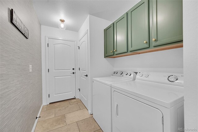 3838 Brush Rd, Castle Rock, CO 80108 - washroom with cabinet space, stone tile floors, washing machine and dryer, and baseboards