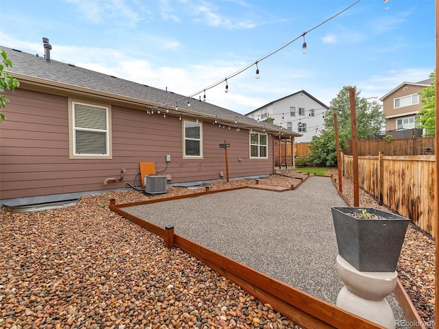 3838 Brush Rd, Castle Rock, CO 80108 - rear view of house with a patio and central AC unit