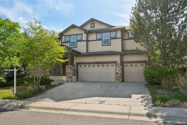 13075 Tamarac St, Thornton, CO 80602 - craftsman-style house with an attached garage, driveway, and stone siding