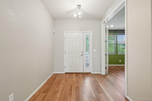 13075 Tamarac St, Thornton, CO 80602 - foyer entrance featuring light wood finished floors and baseboards