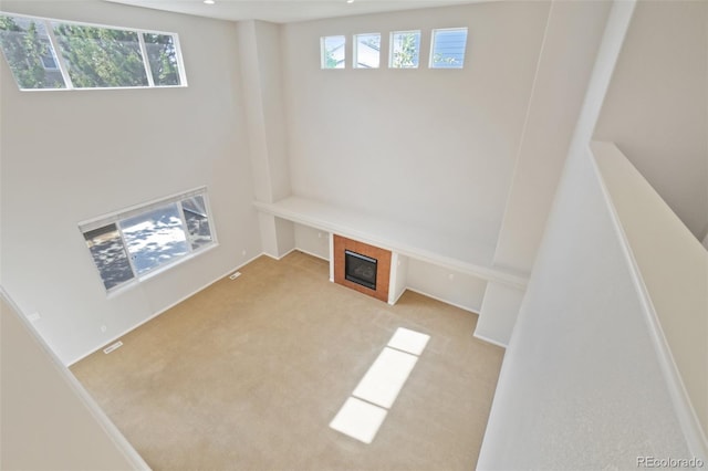 13075 Tamarac St, Thornton, CO 80602 - mudroom featuring carpet flooring and a fireplace