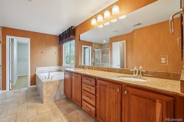 13075 Tamarac St, Thornton, CO 80602 - full bathroom featuring a shower stall, double vanity, a garden tub, and tile patterned floors