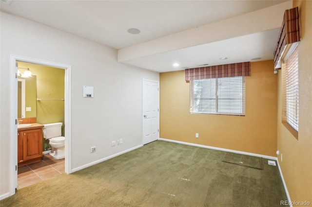 13075 Tamarac St, Thornton, CO 80602 - unfurnished bedroom featuring baseboards, carpet floors, and connected bathroom