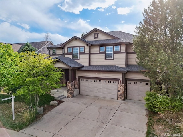 13075 Tamarac St, Thornton, CO 80602 - view of front of house featuring a garage, driveway, roof with shingles, and stone siding