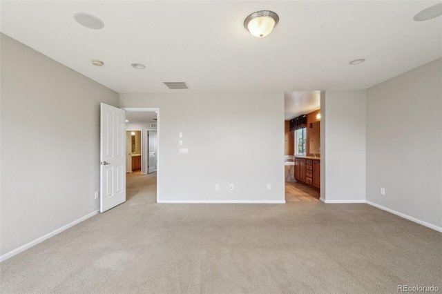 13075 Tamarac St, Thornton, CO 80602 - spare room featuring light colored carpet, baseboards, and a smoke detector