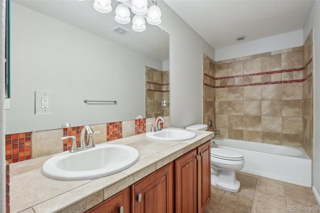 13075 Tamarac St, Thornton, CO 80602 - bathroom with toilet, double vanity, backsplash, shower / tub combination, and a chandelier