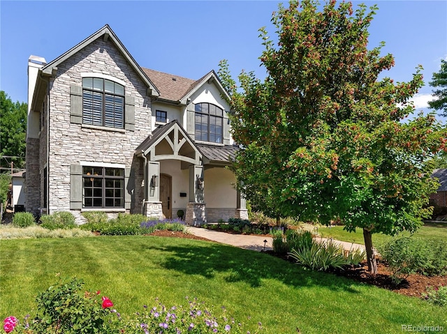 852 Pontiac St, Denver, CO 80220 - view of front of property featuring stone siding and a front lawn