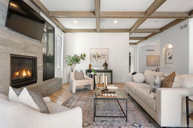 852 Pontiac St, Denver, CO 80220 - living area featuring wood finished floors, a glass covered fireplace, beamed ceiling, coffered ceiling, and recessed lighting