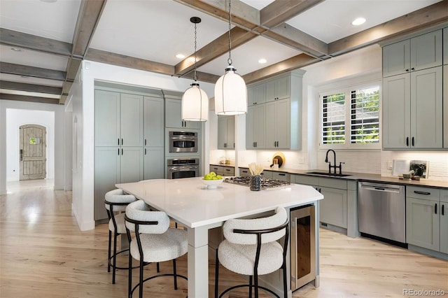 852 Pontiac St, Denver, CO 80220 - kitchen featuring stainless steel appliances, coffered ceiling, tasteful backsplash, beamed ceiling, and light wood-style flooring