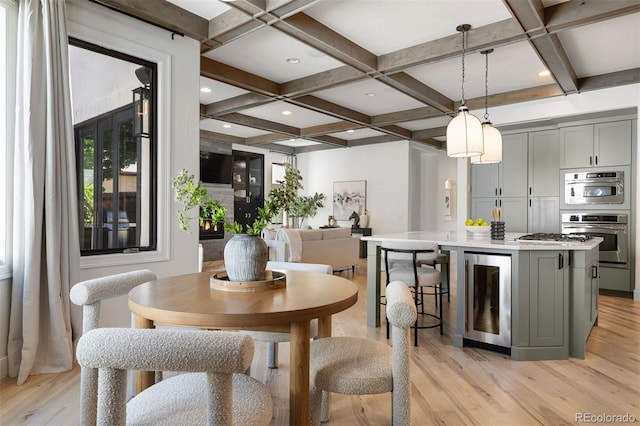 852 Pontiac St, Denver, CO 80220 - dining room with beverage cooler, coffered ceiling, beam ceiling, light wood-style flooring, and plenty of natural light