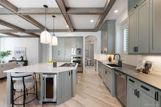 852 Pontiac St, Denver, CO 80220 - kitchen with beverage cooler, stainless steel appliances, tasteful backsplash, a kitchen bar, and coffered ceiling