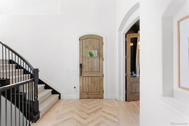 852 Pontiac St, Denver, CO 80220 - entrance foyer featuring arched walkways and stairway