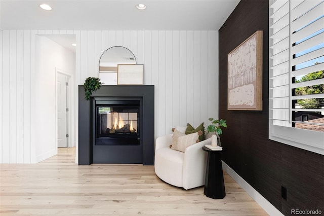 852 Pontiac St, Denver, CO 80220 - living area with wood finished floors, recessed lighting, a multi sided fireplace, and wood walls