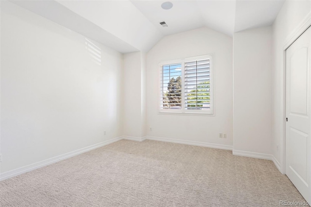 852 Pontiac St, Denver, CO 80220 - unfurnished bedroom featuring vaulted ceiling and light carpet