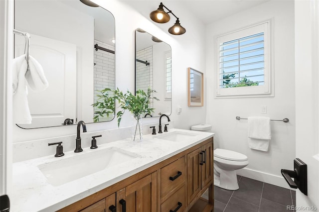 852 Pontiac St, Denver, CO 80220 - bathroom with double vanity, a shower, and tile patterned floors