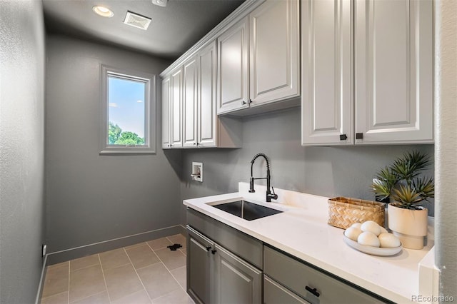 852 Pontiac St, Denver, CO 80220 - laundry area featuring washer hookup, cabinet space, light tile patterned floors, and recessed lighting