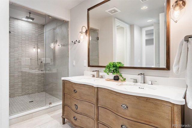 852 Pontiac St, Denver, CO 80220 - bathroom with double vanity, a stall shower, tile patterned flooring, and recessed lighting