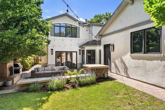 852 Pontiac St, Denver, CO 80220 - back of house with an outdoor living space, stucco siding, and a yard