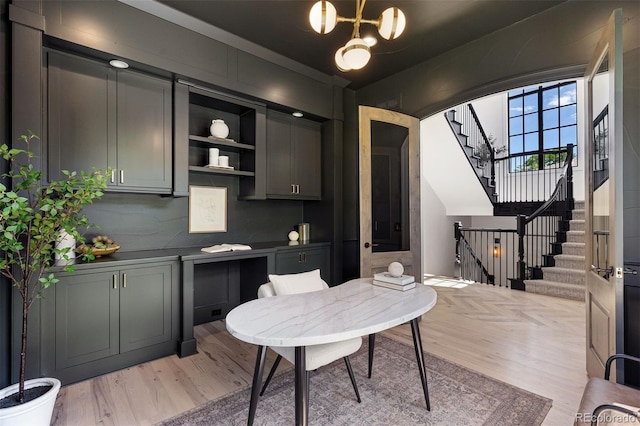 852 Pontiac St, Denver, CO 80220 - office space with light wood-style flooring, arched walkways, and a chandelier