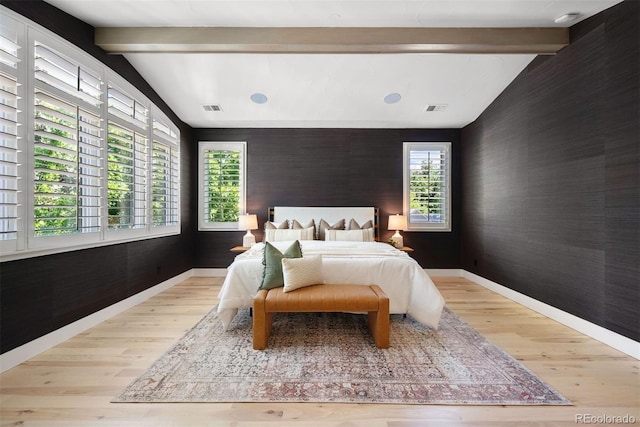 852 Pontiac St, Denver, CO 80220 - bedroom with an accent wall, wood finished floors, and wallpapered walls