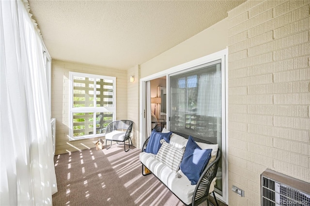 sunroom / solarium featuring heating unit