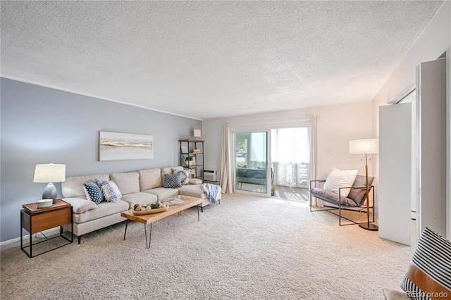 living room featuring a wall mounted AC, a textured ceiling, and light colored carpet