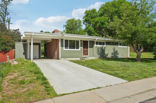 6155 Carr St, Arvada, CO 80004 - ranch-style house featuring concrete driveway, a chimney, a carport, and entry steps