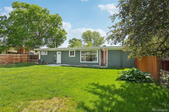 6155 Carr St, Arvada, CO 80004 - rear view of property featuring central AC