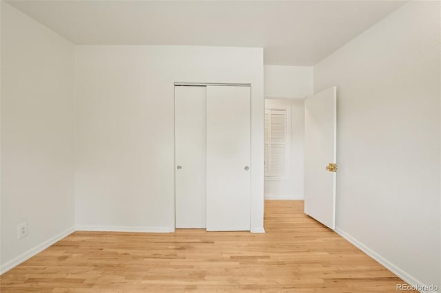 6155 Carr St, Arvada, CO 80004 - unfurnished bedroom featuring light wood-style flooring, a closet, and baseboards