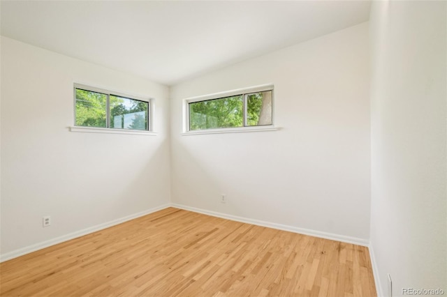 6155 Carr St, Arvada, CO 80004 - spare room featuring baseboards and light wood finished floors