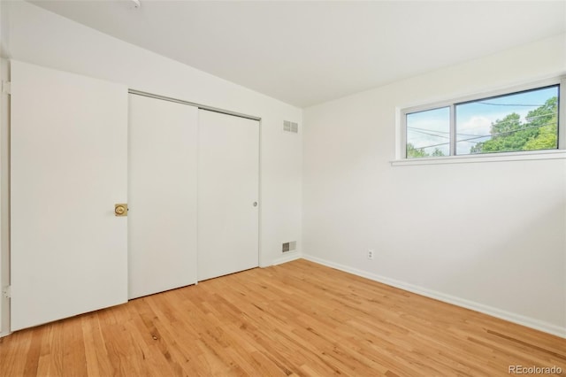 6155 Carr St, Arvada, CO 80004 - unfurnished bedroom with light wood-style flooring, a closet, and baseboards