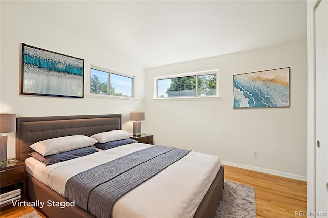 6155 Carr St, Arvada, CO 80004 - bedroom featuring wood finished floors and baseboards