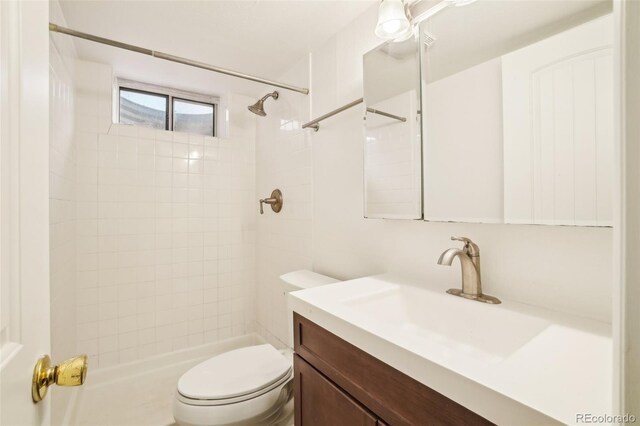 6155 Carr St, Arvada, CO 80004 - full bathroom with vanity, toilet, and a tile shower