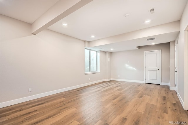 basement featuring light hardwood / wood-style floors