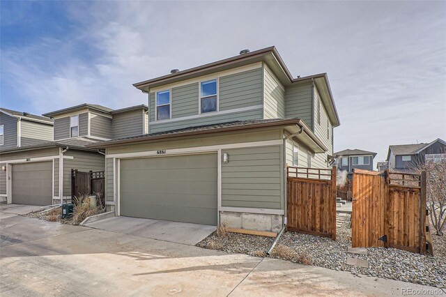 front facade with a garage