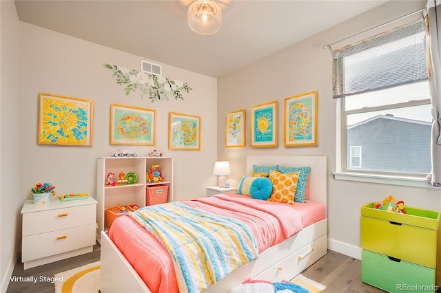 bedroom featuring light wood-type flooring