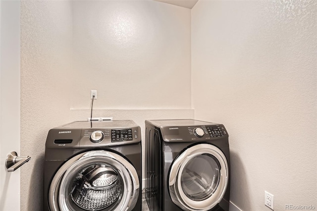 laundry room featuring washing machine and dryer