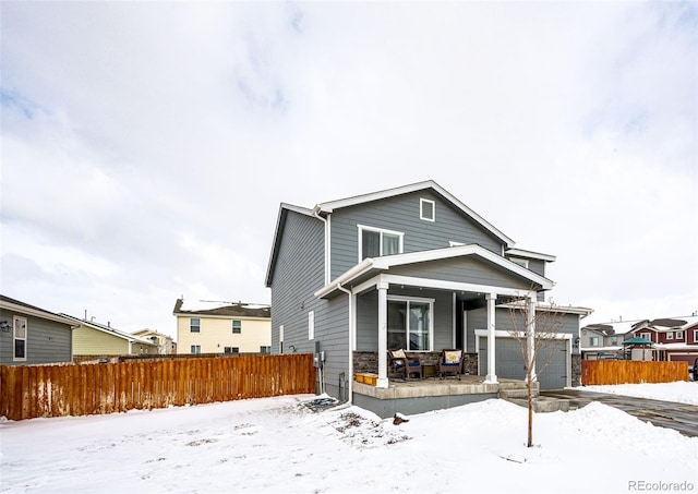 view of front of house with covered porch and a garage