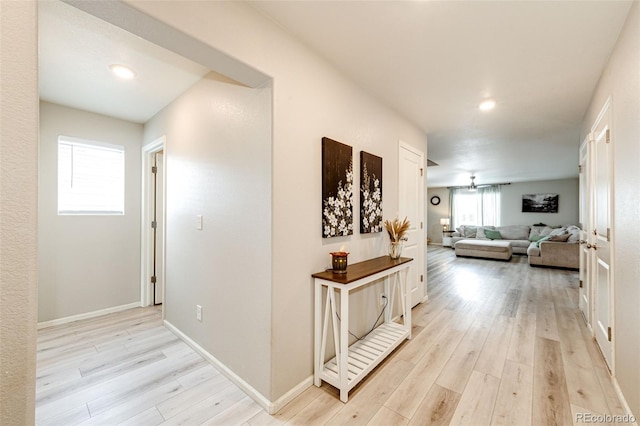 hall with light hardwood / wood-style floors