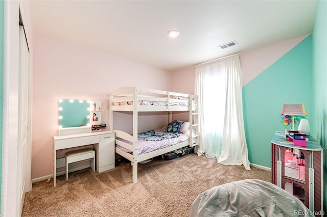 bedroom featuring light colored carpet