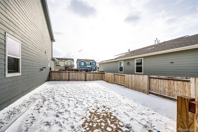 view of yard covered in snow