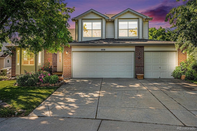1010 Home Farm Cir, Denver, CO 80234 - traditional home featuring an attached garage, concrete driveway, and brick siding