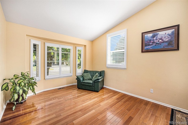 1010 Home Farm Cir, Denver, CO 80234 - sitting room featuring vaulted ceiling and light wood-style flooring