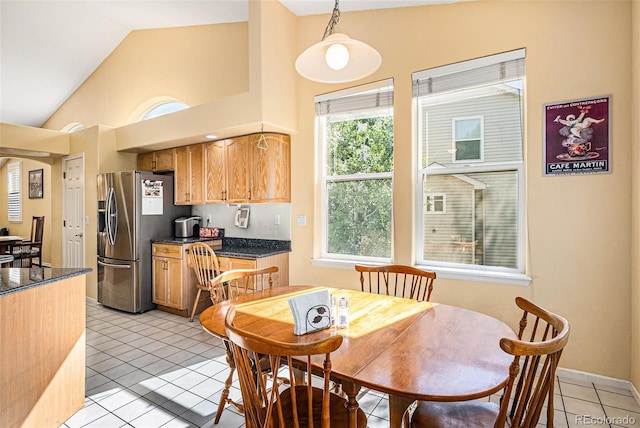 1010 Home Farm Cir, Denver, CO 80234 - dining room featuring light tile patterned floors and lofted ceiling