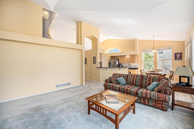 1010 Home Farm Cir, Denver, CO 80234 - living room featuring light colored carpet and vaulted ceiling