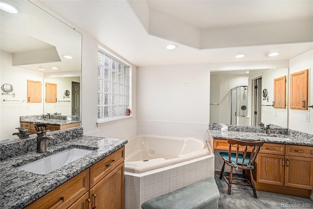 1010 Home Farm Cir, Denver, CO 80234 - full bath featuring recessed lighting, a stall shower, a garden tub, and two vanities
