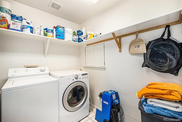 1010 Home Farm Cir, Denver, CO 80234 - laundry area featuring washing machine and clothes dryer and light tile patterned floors
